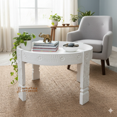 Wooden coffee table with white wash finish .