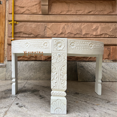 Wooden coffee table with white wash finish .