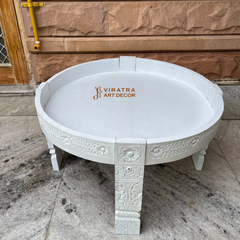 Wooden coffee table with white wash finish .
